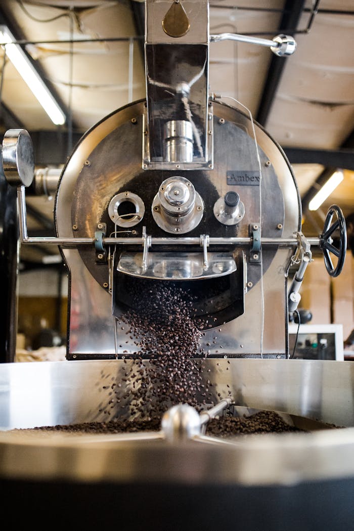 Coffee beans roasting in a large industrial roaster at Greensboro, NC.